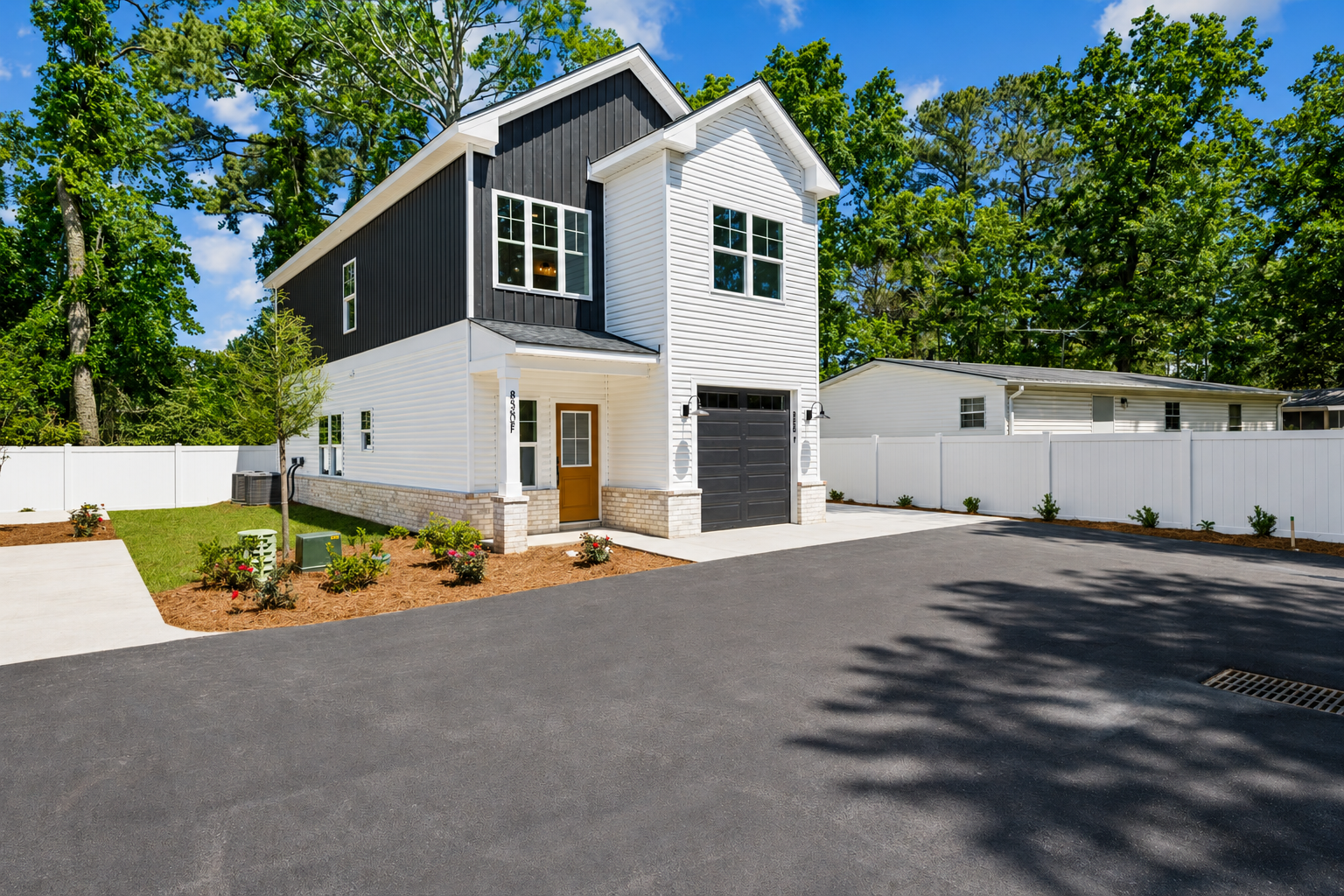 Board-and-batten coastal home exterior with standing-seam metal roof